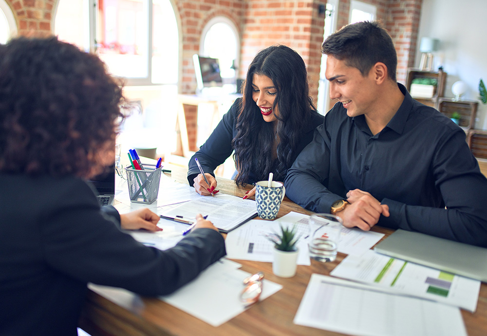 couple meeting with mortgage lender