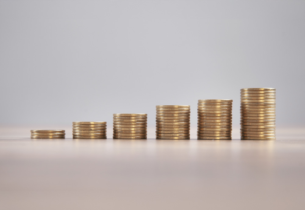 stacks of coins each increasing in height