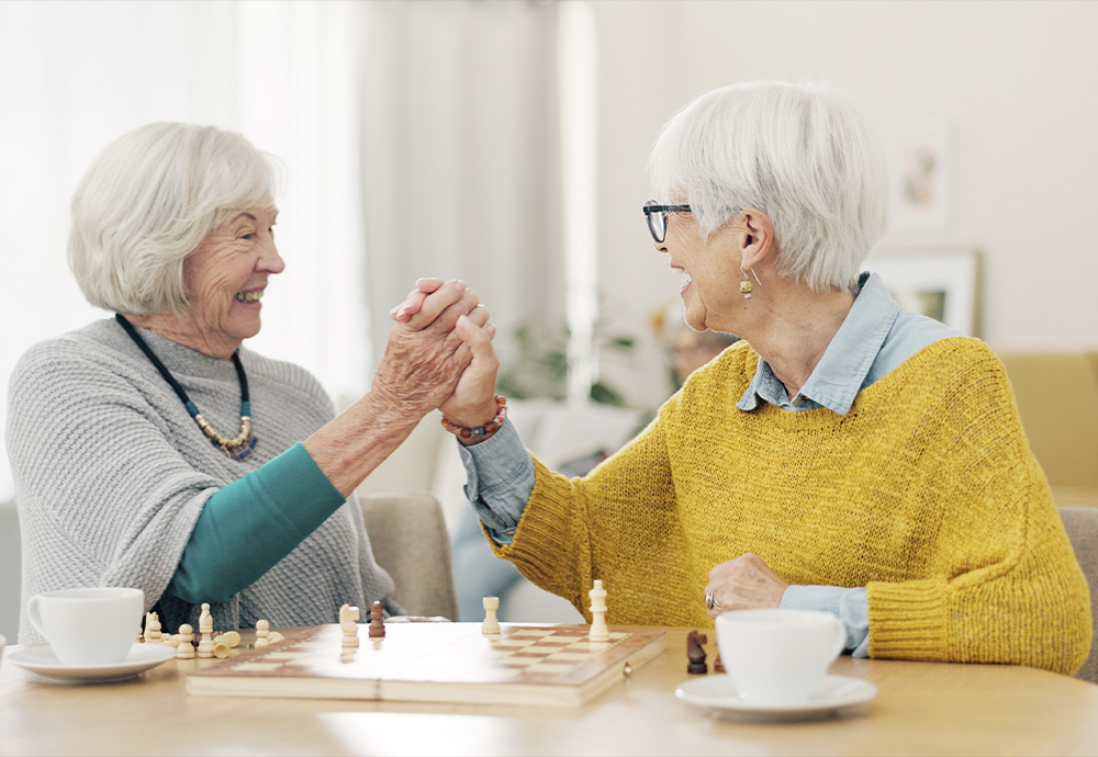 senior women playing chess